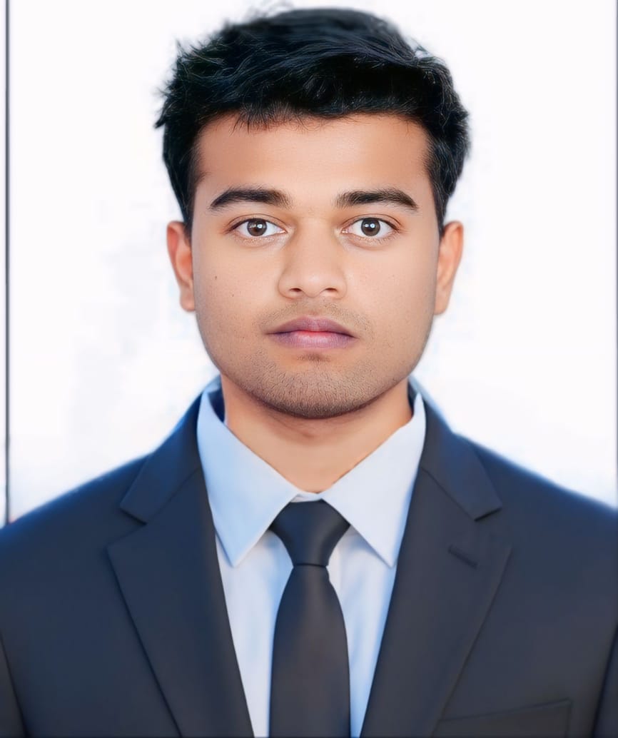 Shubham Kumar smiling and facing forward in a professional setting with a neutral background, conveying a confident and approachable mood